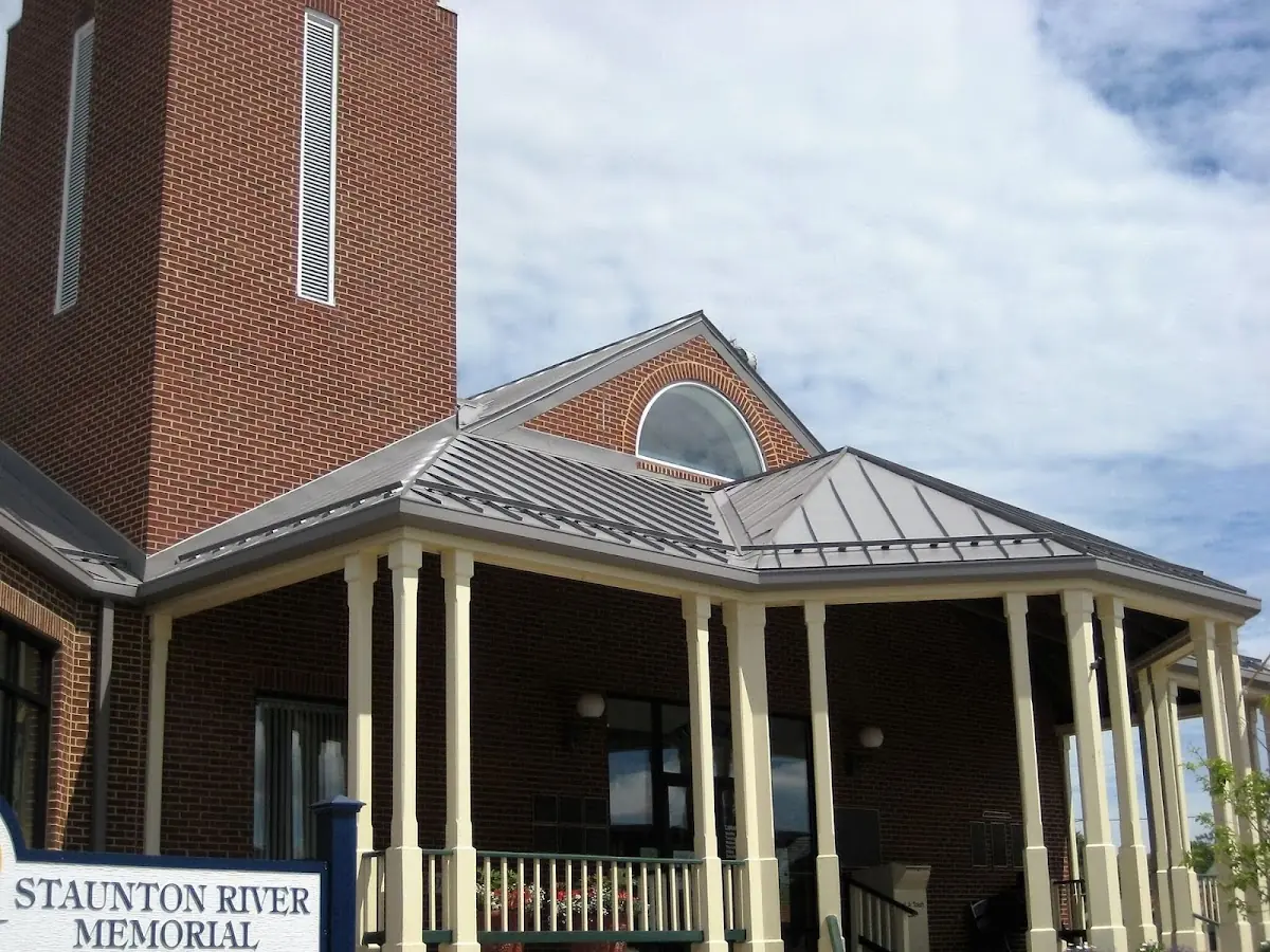 Skilled roofing craftsmen working on a residential roof in Sudbury